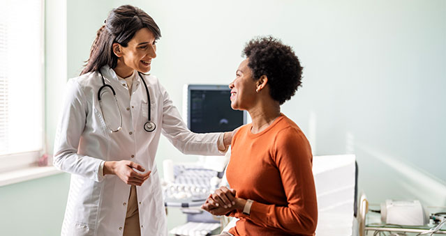 A woman at the doctor's office checking for signs of lupus.