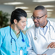 Two male medical professionals talking
