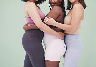 Three women hugging in their underware